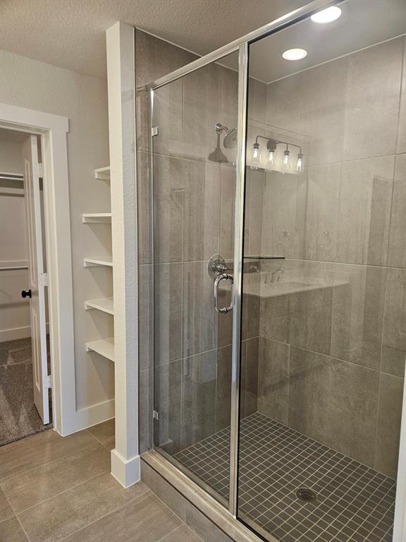 221 Chestnut Street Celina, TX 75009 - Photo 9 of 23 a bathroom with a shower and a sink