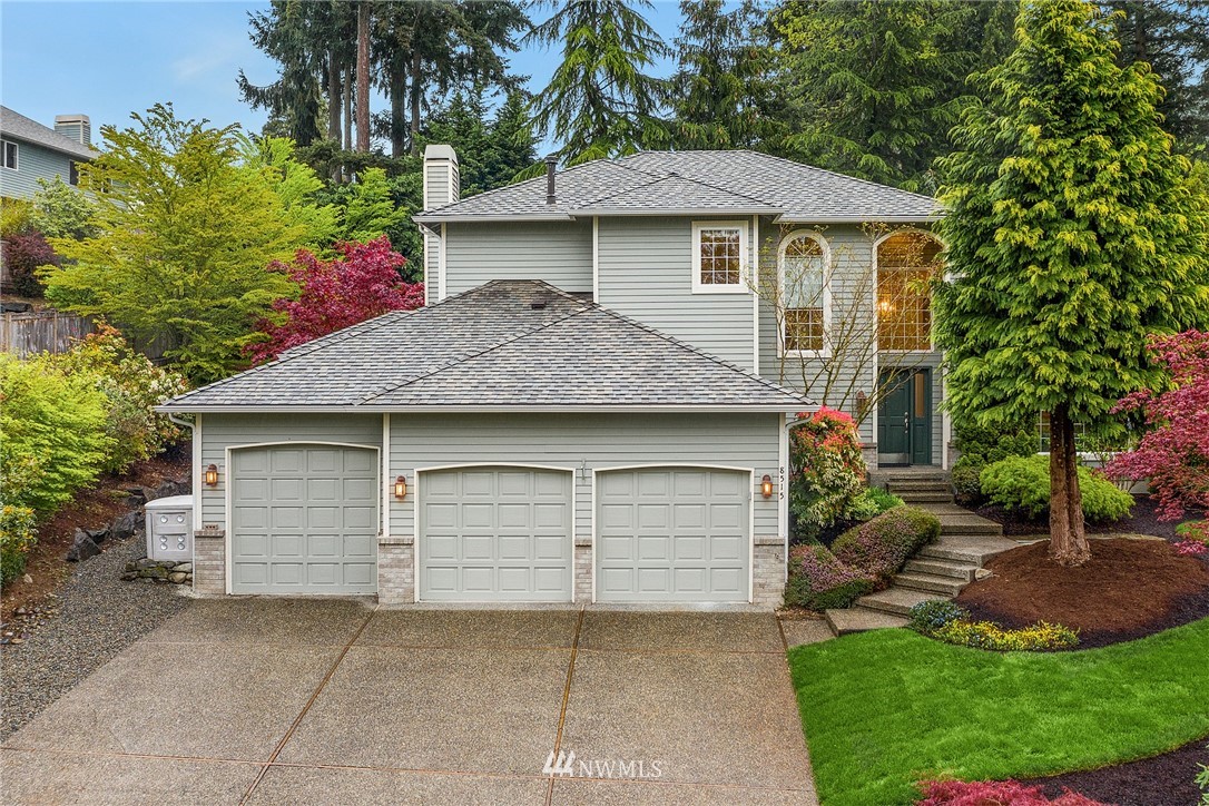 8515 Northeast 176th Street Bothell, WA 98011 - Photo 1 of 25 a front view of a house with a garden