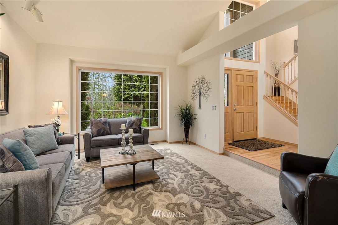 8515 Northeast 176th Street Bothell, WA 98011 - Photo 12 of 25 a living room with furniture and a rug