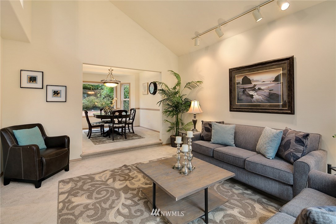 8515 Northeast 176th Street Bothell, WA 98011 - Photo 13 of 25 a living room with furniture a rug and a table