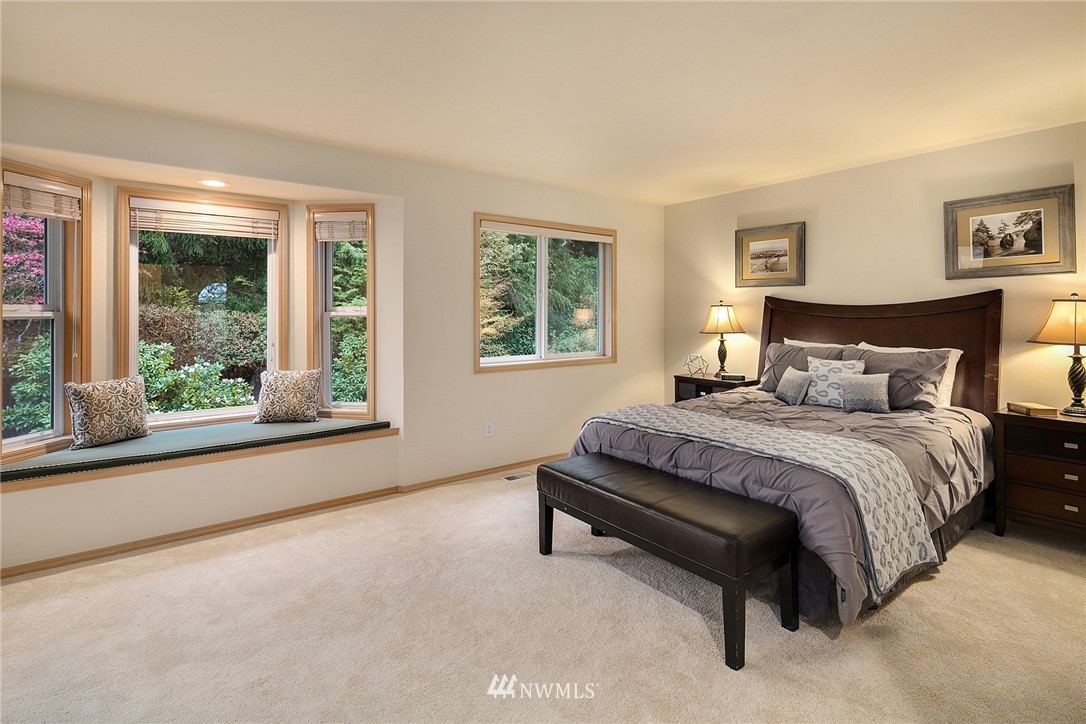 8515 Northeast 176th Street Bothell, WA 98011 - Photo 18 of 25 a bedroom with a bed and window