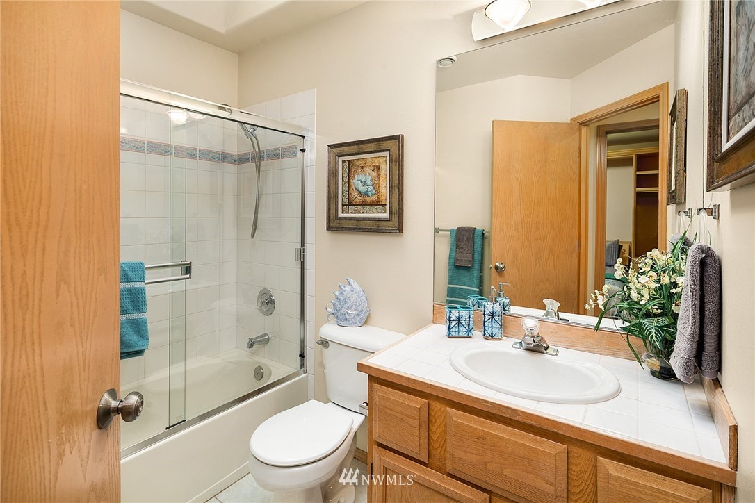 8515 Northeast 176th Street Bothell, WA 98011 - Photo 21 of 25 a bathroom with a sink toilet and shower