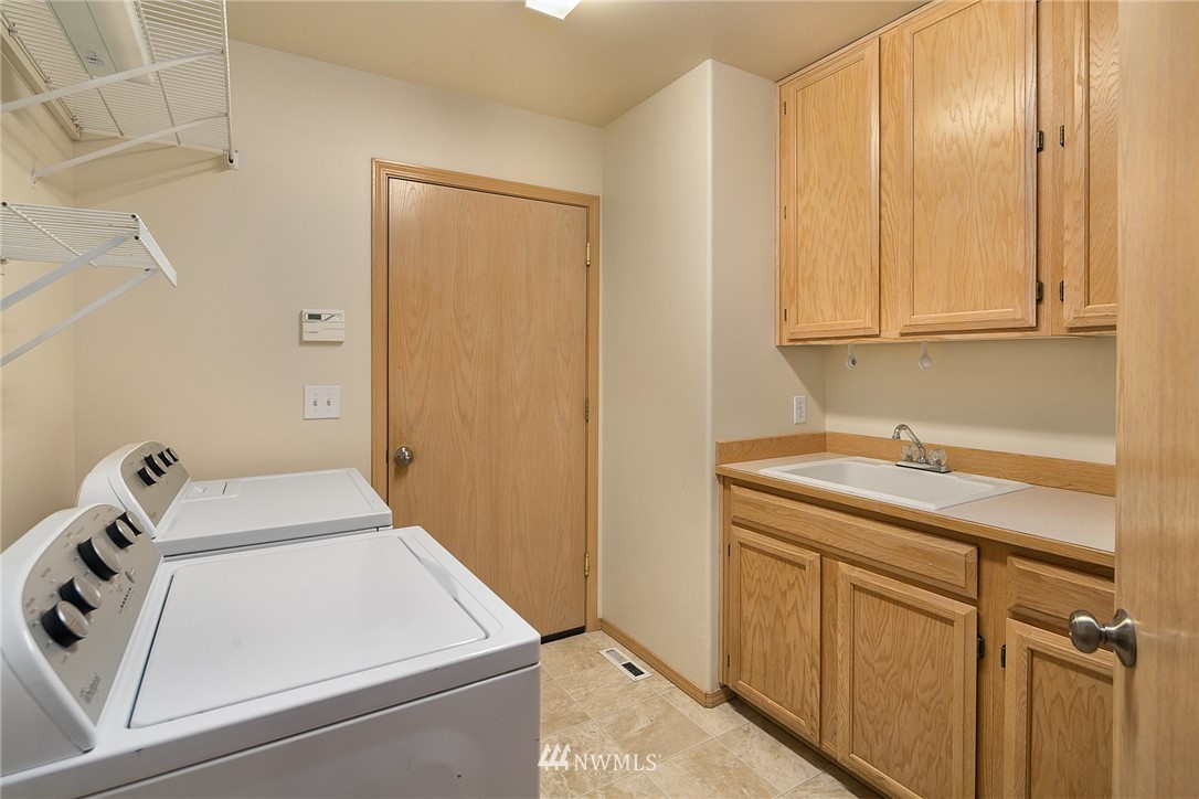 8515 Northeast 176th Street Bothell, WA 98011 - Photo 22 of 25 a room with storage and utility