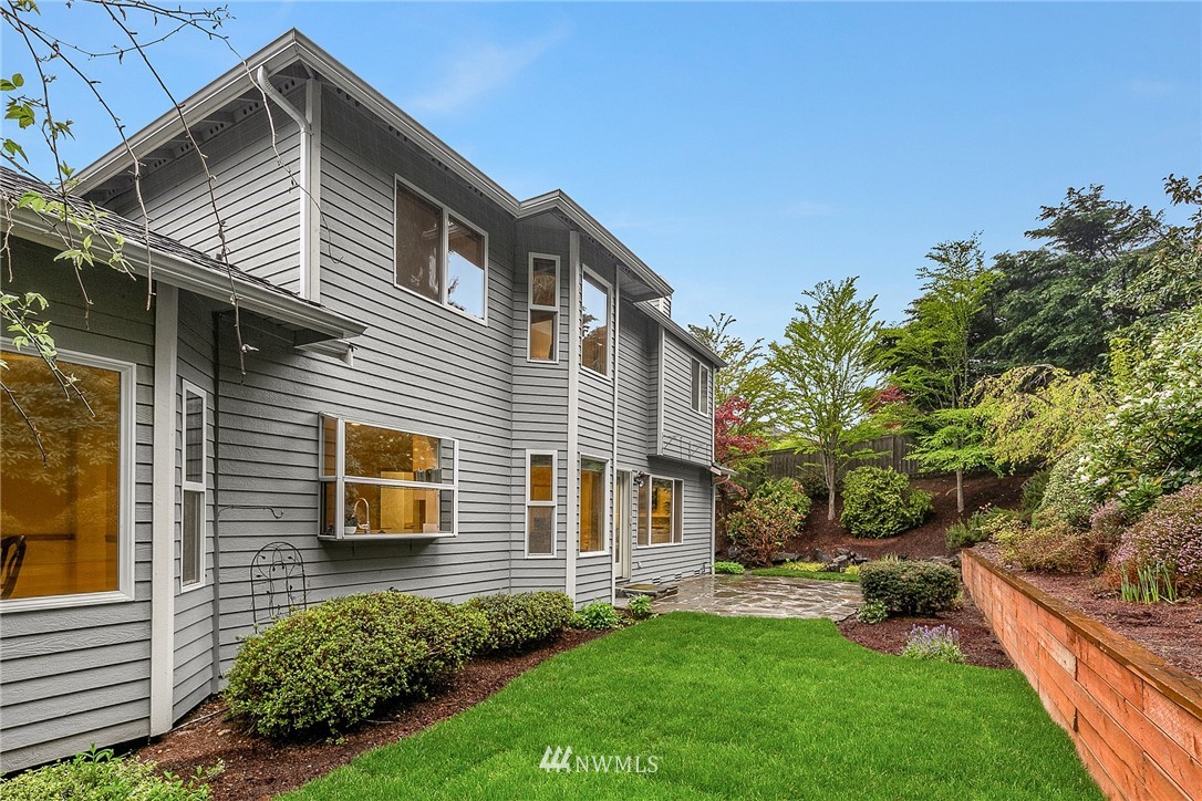 8515 Northeast 176th Street Bothell, WA 98011 - Photo 24 of 25 a front view of a house with a yard