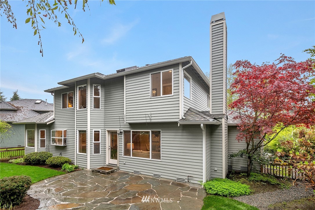 8515 Northeast 176th Street Bothell, WA 98011 - Photo 25 of 25 a front view of a house with a garden