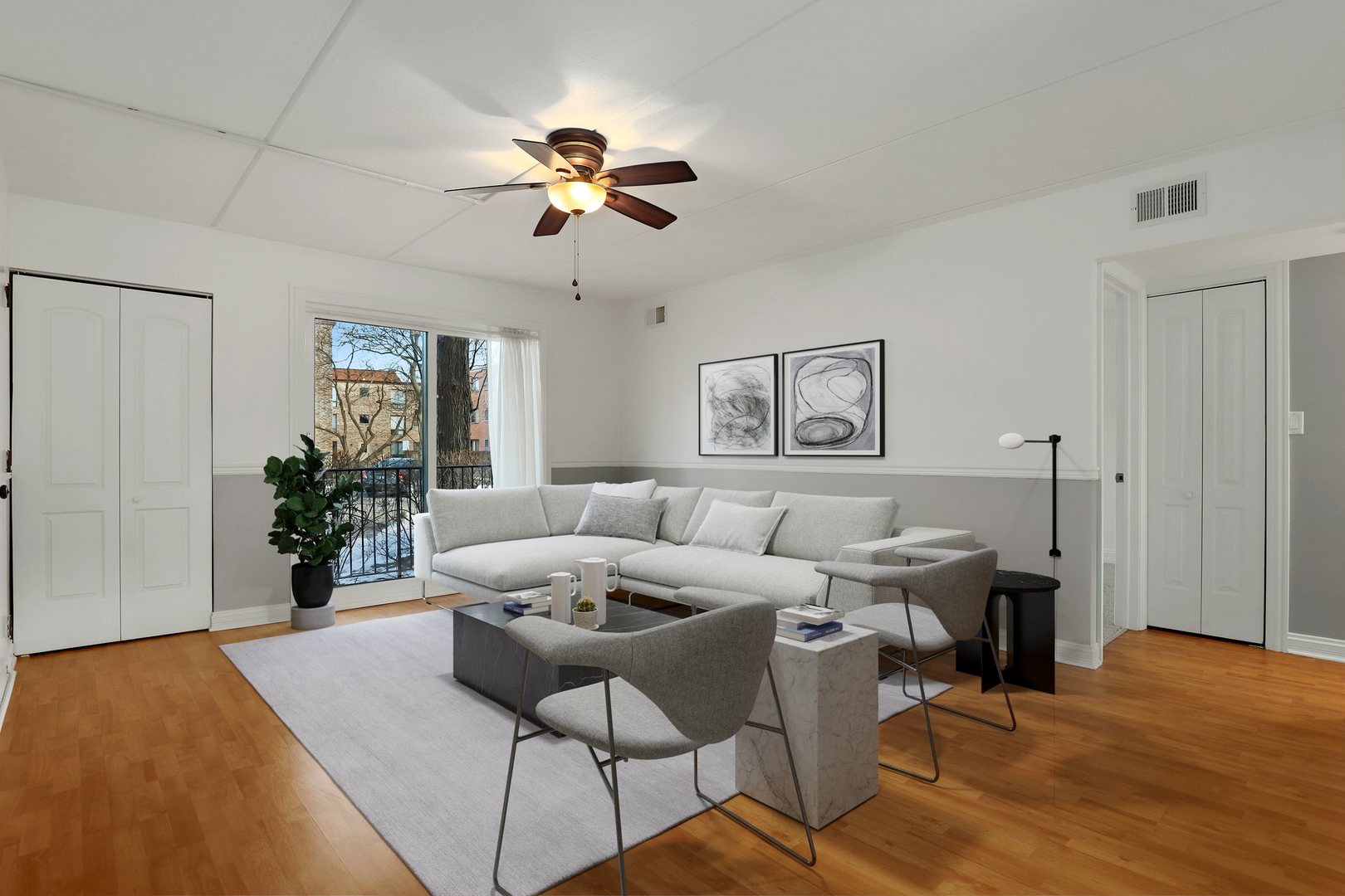 5509 Chateau Drive, Unit 1 Rolling Meadows, IL 60008 - Photo 7 of 16 a living room with furniture and a chandelier