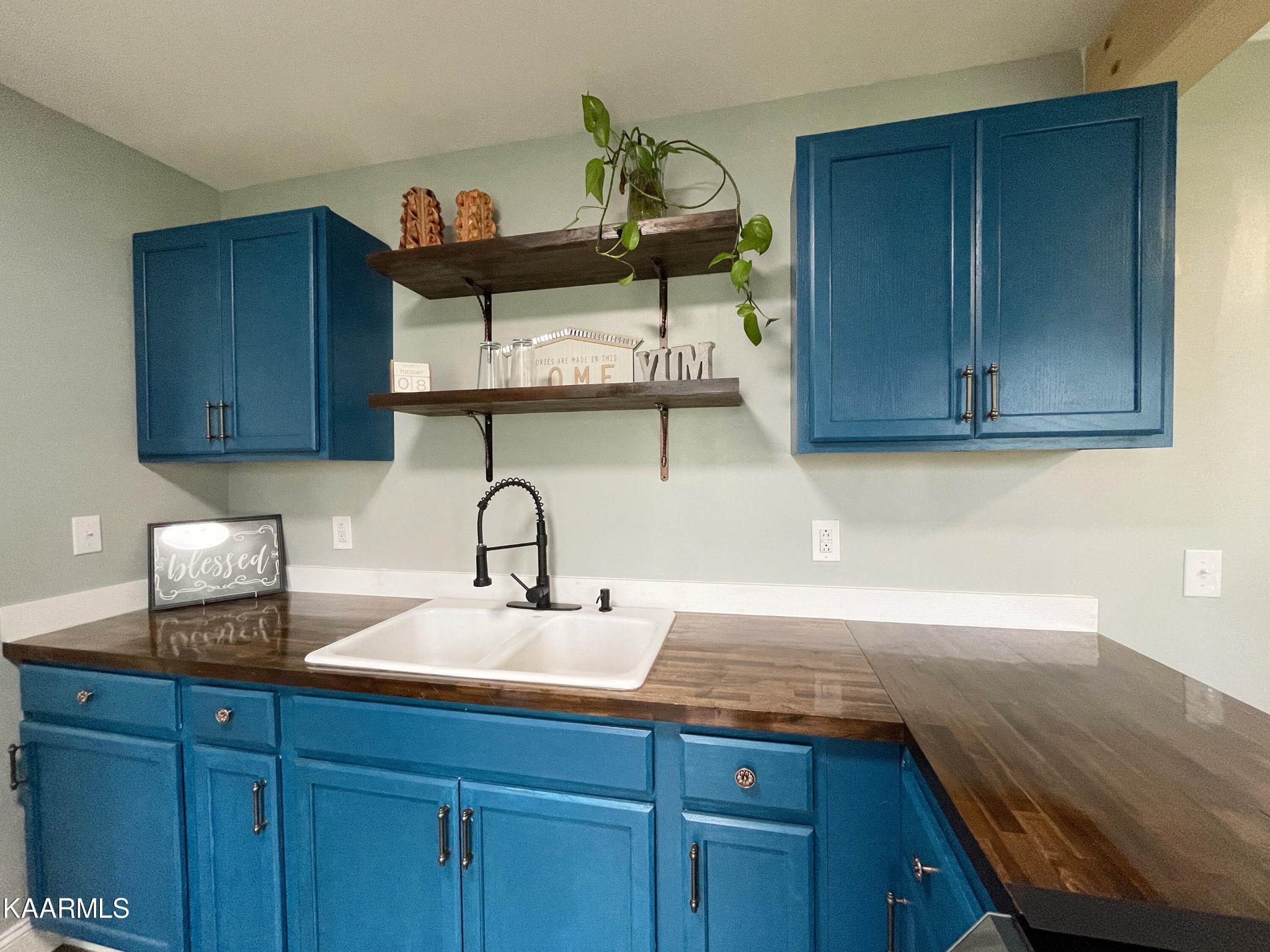 957 West Creston Road Crossville, TN 38571 - Photo 10 of 39 a kitchen with a sink cabinets and wooden floor