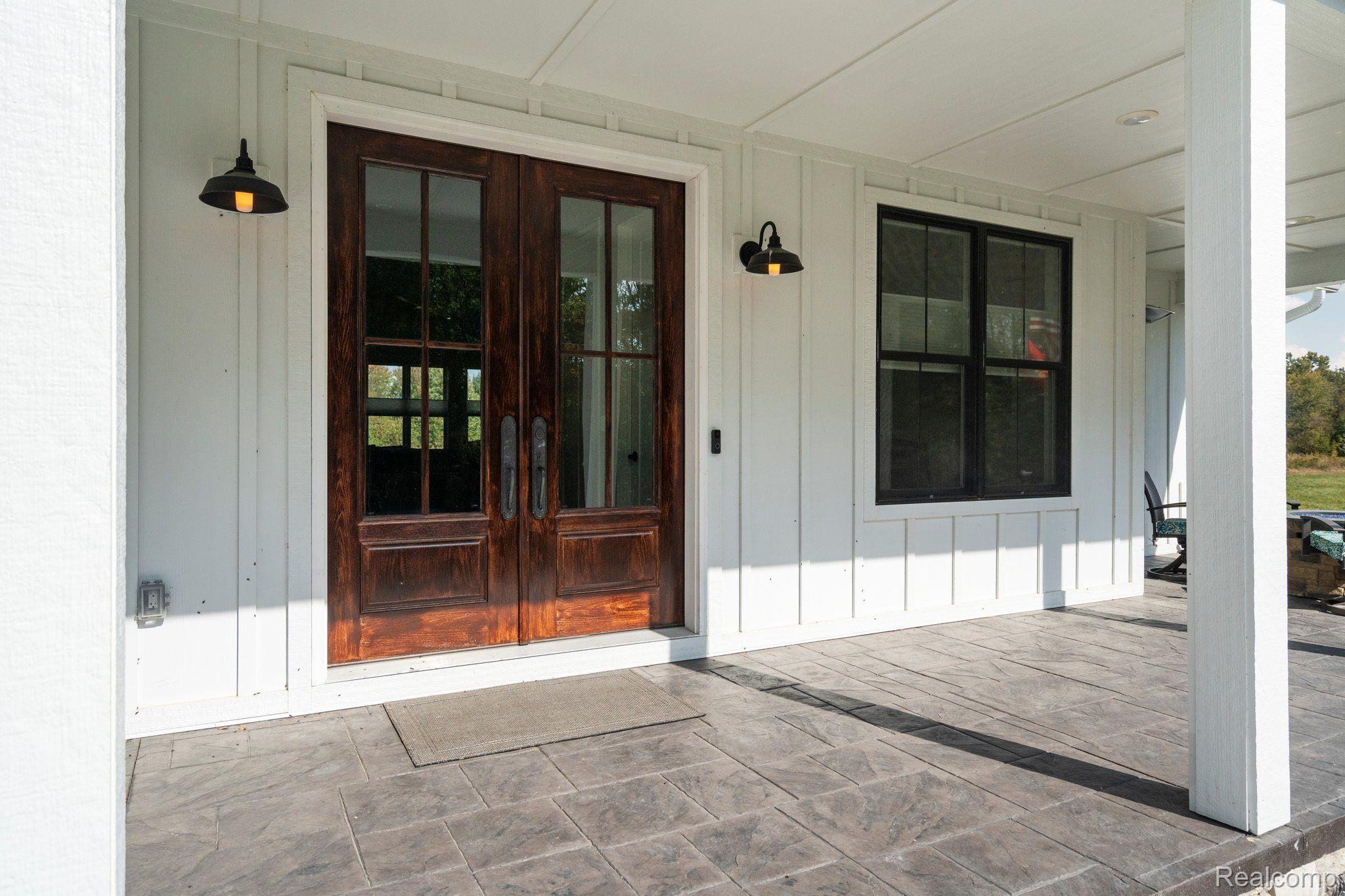 5057 Pardee Road East Webberville, MI 48892 - Photo 4 of 78 Double Door Wood Entry with Stamped Concrete porch