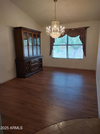 a view of kitchen and dining room with wooden floor