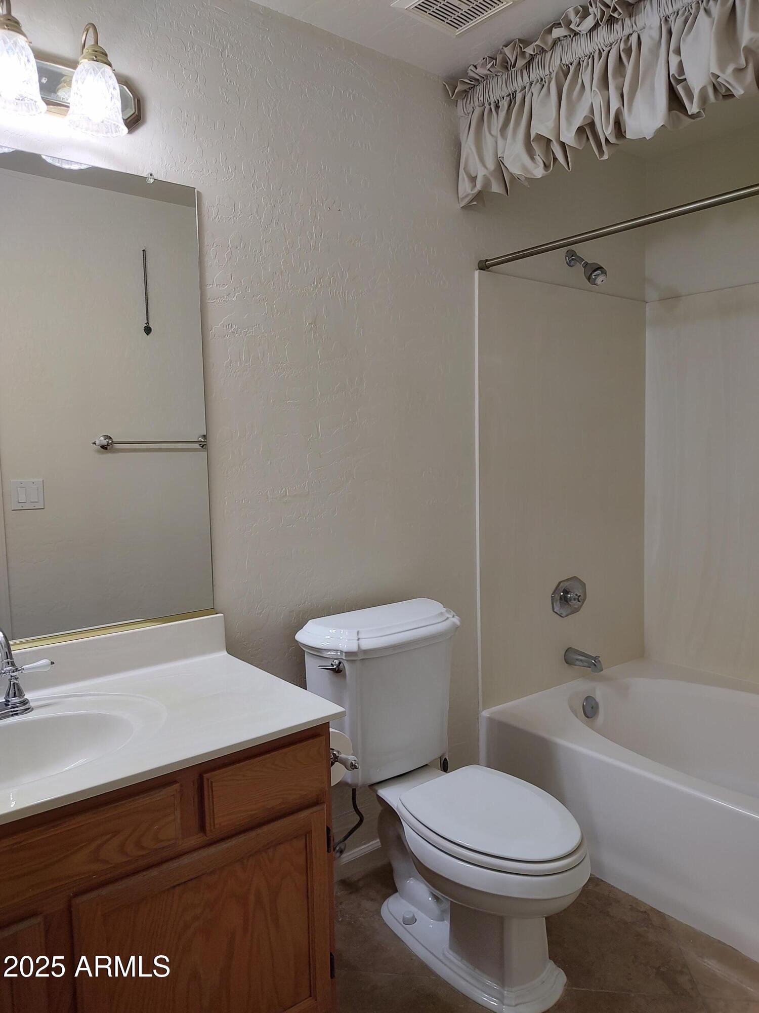1365 West Courtney Lane Tempe, AZ 85284 - Photo 16 of 24 a bathroom with a sink a toilet and bathtub