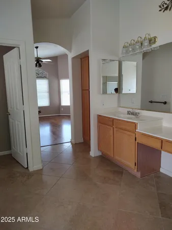 a view of a kitchen with a sink and a refrigerator