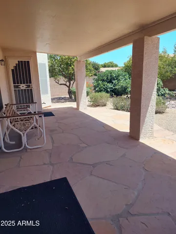 a view of a room with furniture and a window
