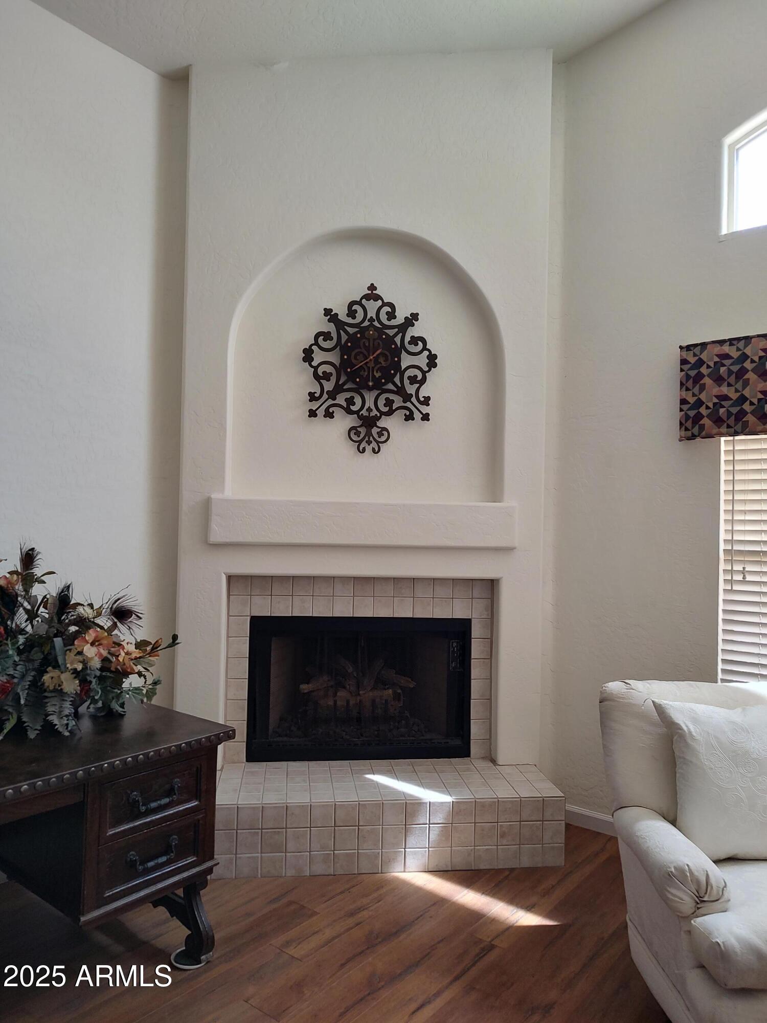 1365 West Courtney Lane Tempe, AZ 85284 - Photo 9 of 24 a living room with furniture and a fireplace