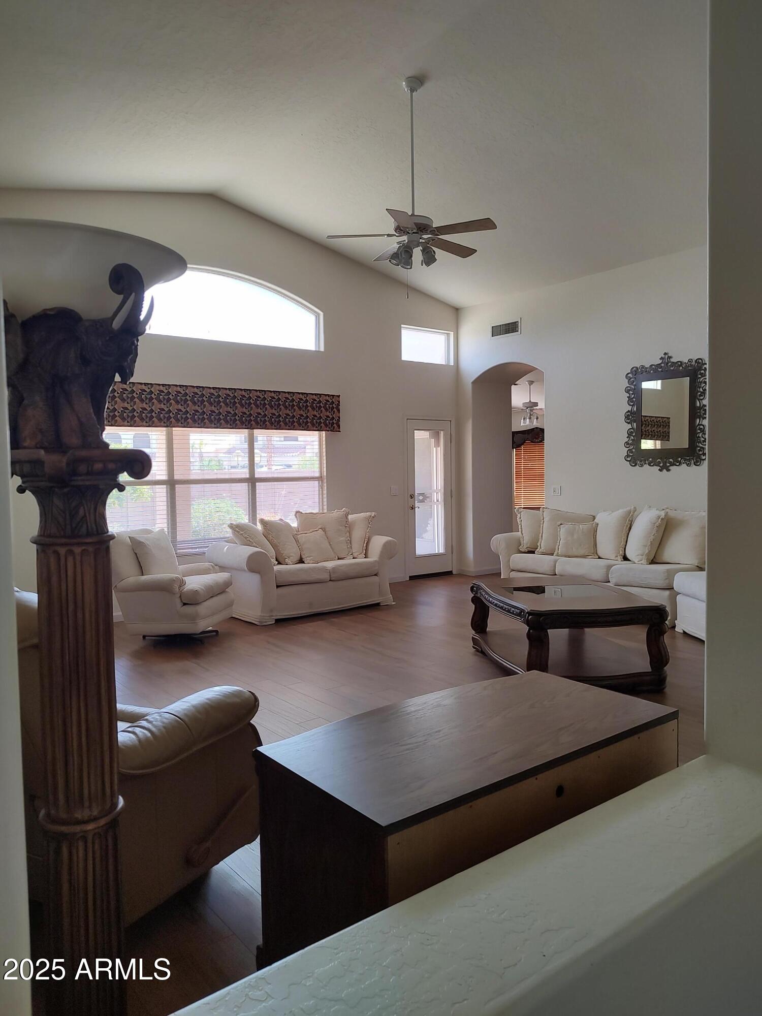 1365 West Courtney Lane Tempe, AZ 85284 - Photo 10 of 24 a living room with furniture and a chandelier