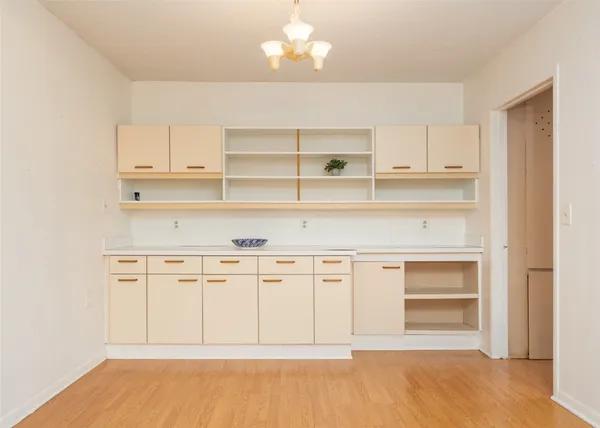 a view of cabinets and window