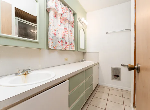 a bathroom with a sink and mirror