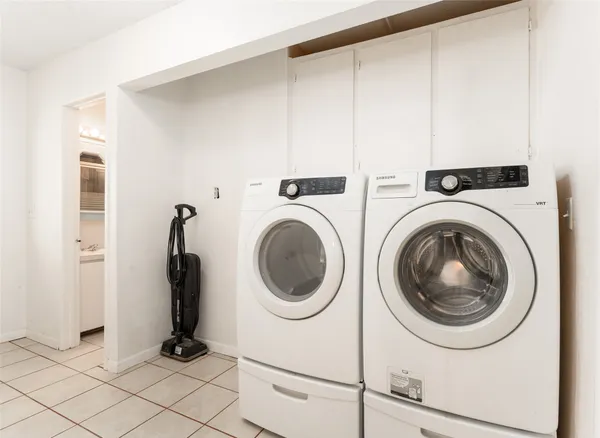 a view of a storage & utility room with washer and dryer