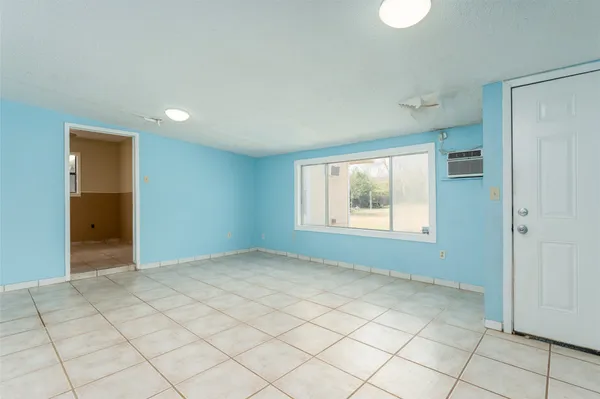 a view of an empty room and window