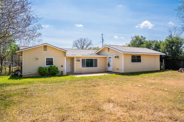 a house view with a backyard space