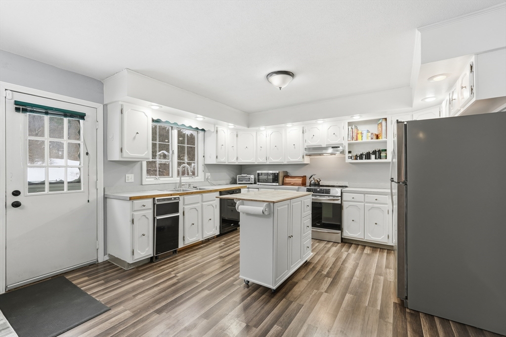 32 Homestead Avenue Greenfield, MA 01301 - Photo 12 of 41 a kitchen with a refrigerator stove and sink