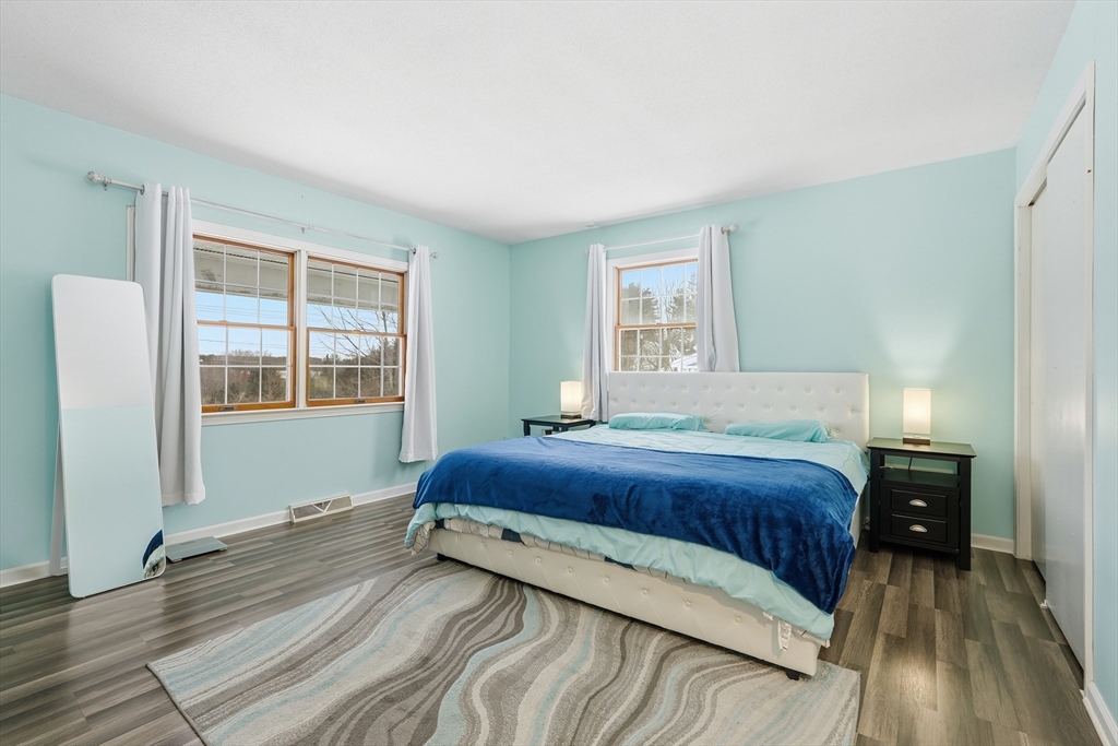 32 Homestead Avenue Greenfield, MA 01301 - Photo 15 of 41 a bedroom with a bed and wooden floor