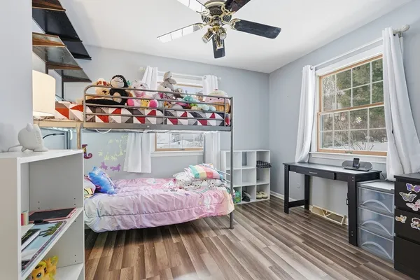 a bedroom with bed and a window