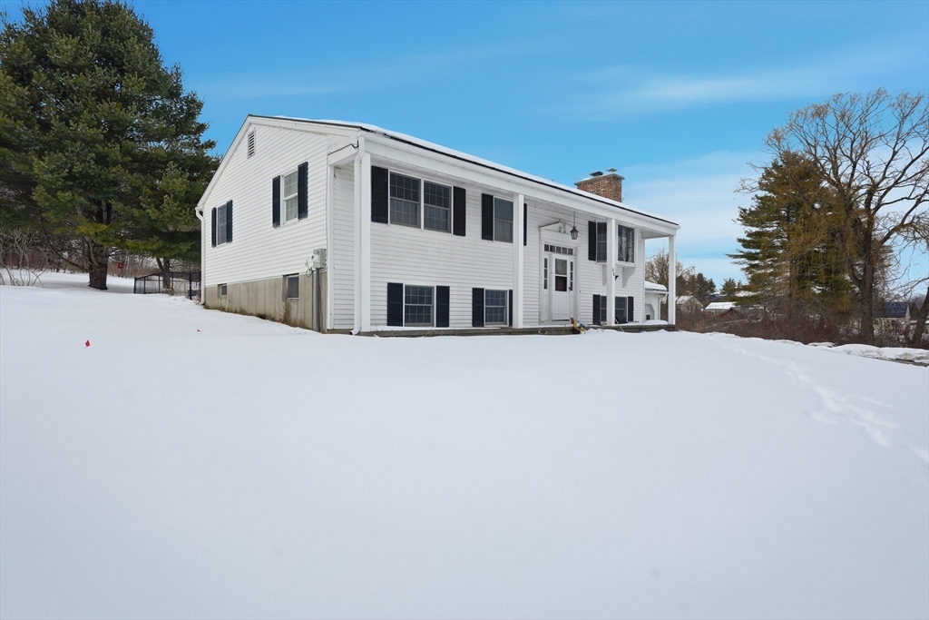 32 Homestead Avenue Greenfield, MA 01301 - Photo 2 of 41 a front view of a house with a yard