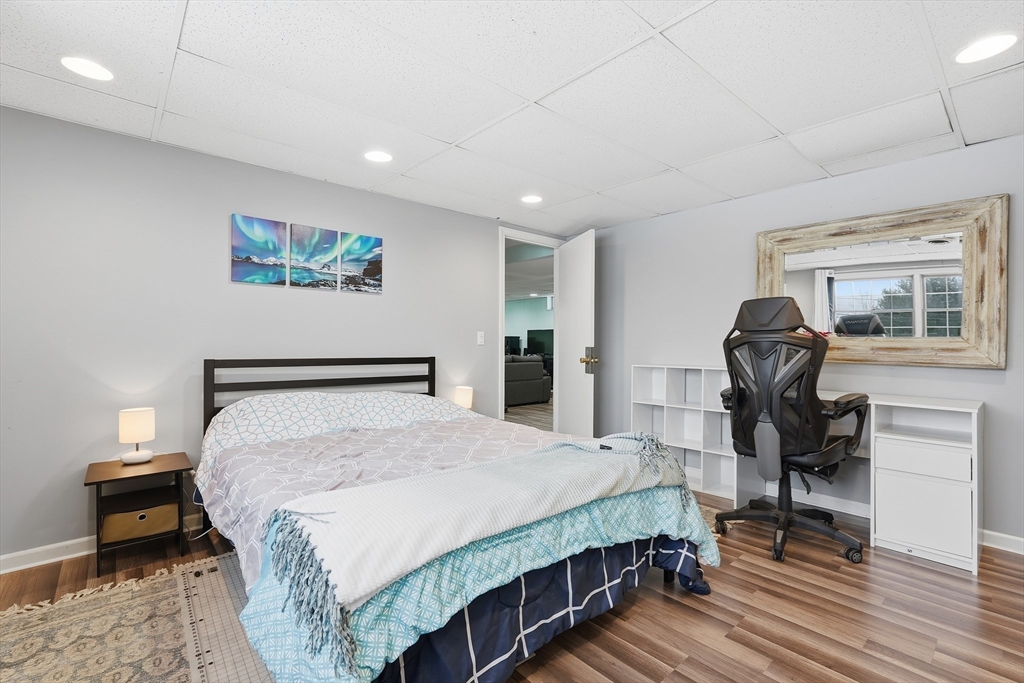 32 Homestead Avenue Greenfield, MA 01301 - Photo 26 of 41 a bedroom with a bed and wooden floor