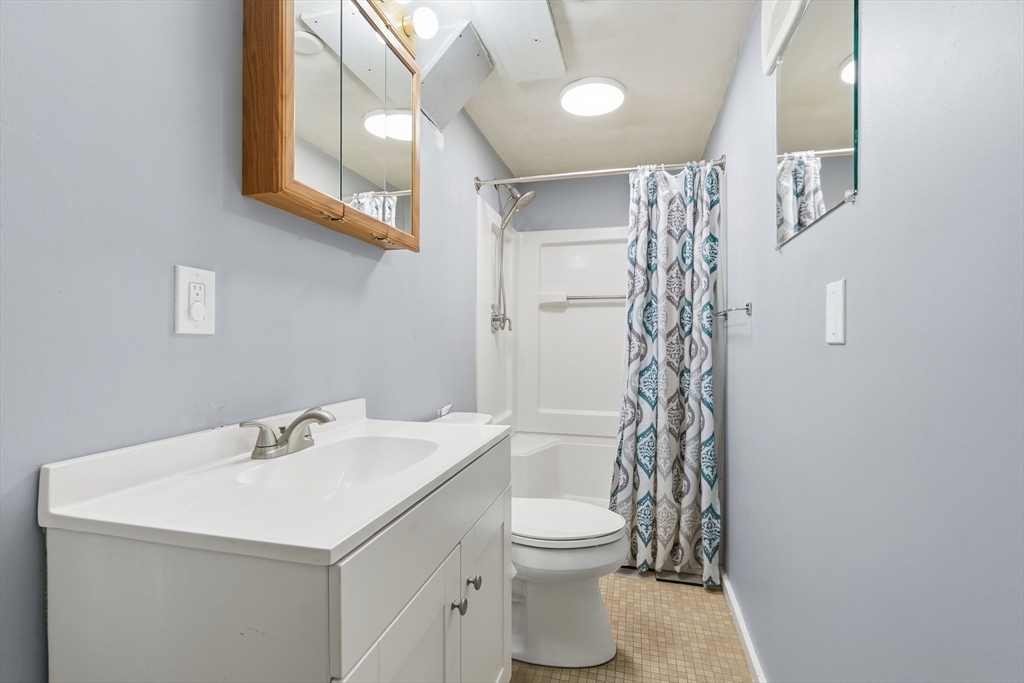32 Homestead Avenue Greenfield, MA 01301 - Photo 28 of 41 a bathroom with a sink a toilet and shower