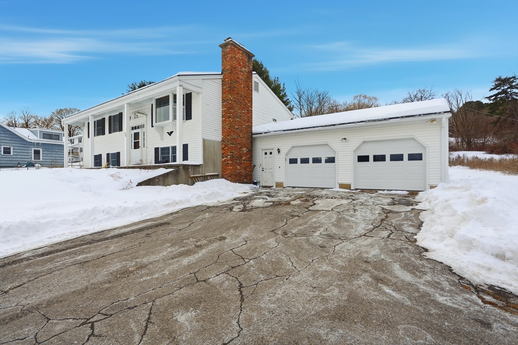 32 Homestead Avenue Greenfield, MA 01301 - Photo 3 of 41 a view of a white house with a yard