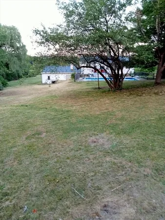 a view of a patio with a table and chairs