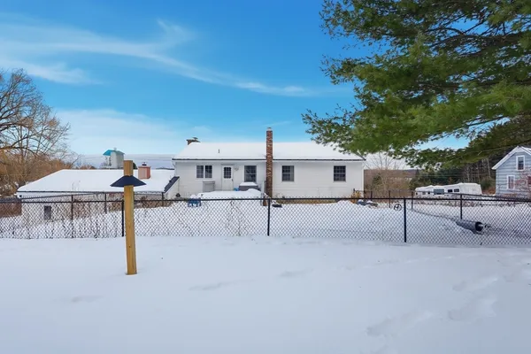 a group of cars parked in front of a house