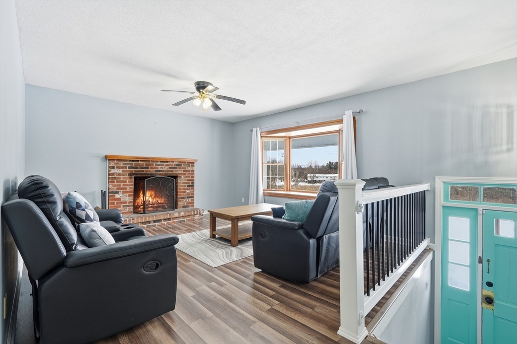 32 Homestead Avenue Greenfield, MA 01301 - Photo 4 of 41 a living room with furniture and a fireplace