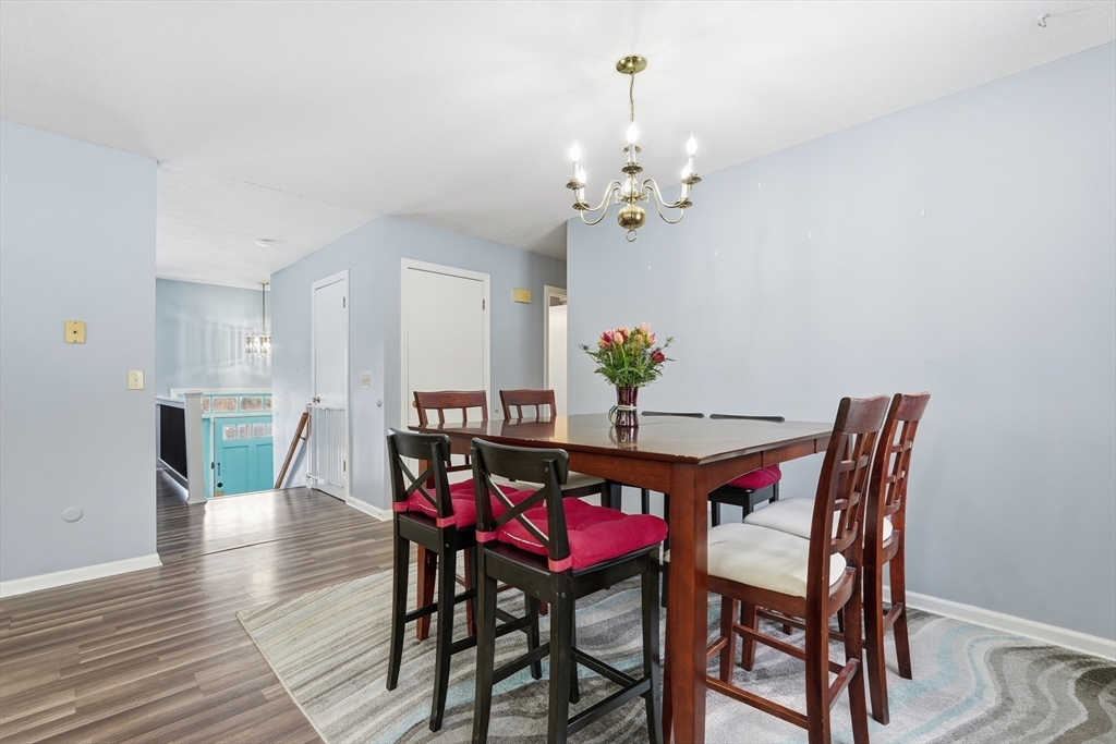 32 Homestead Avenue Greenfield, MA 01301 - Photo 8 of 41 a dining room with furniture a chandelier and wooden floor