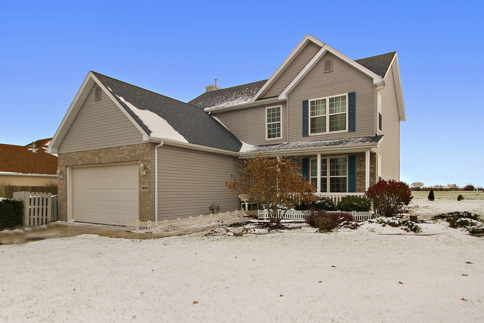 a front view of a house with yard