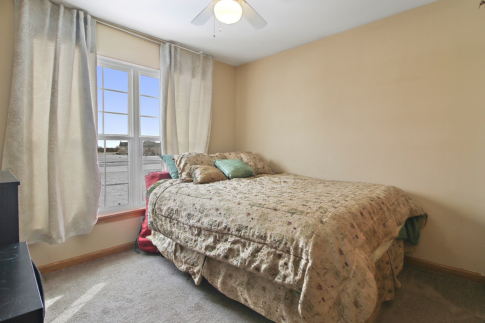 1906 Tallgrass Turn Kankakee, IL 60901 - Photo 15 of 23 a bedroom with a bed and window