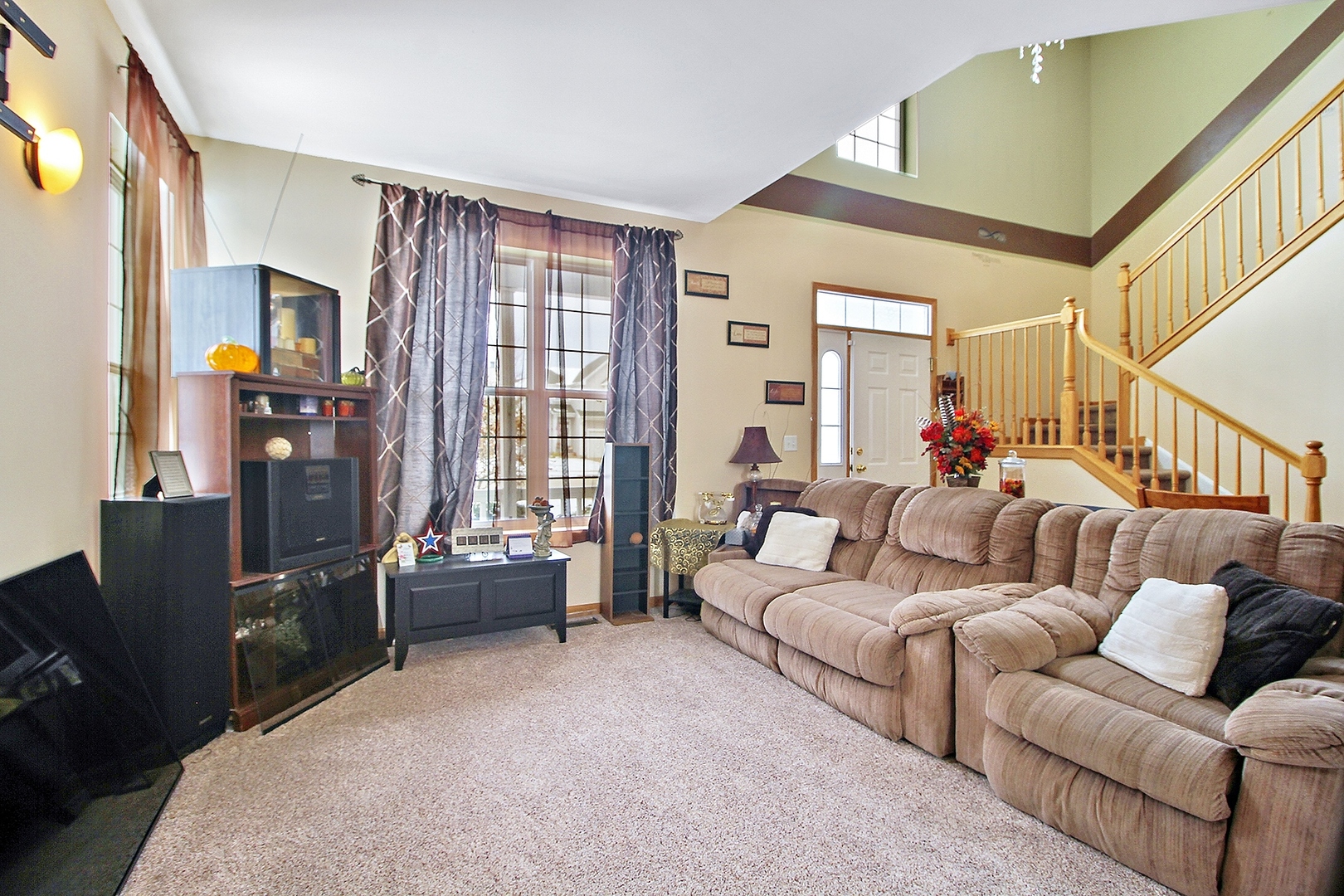 1906 Tallgrass Turn Kankakee, IL 60901 - Photo 3 of 23 a living room with furniture and a flat screen tv