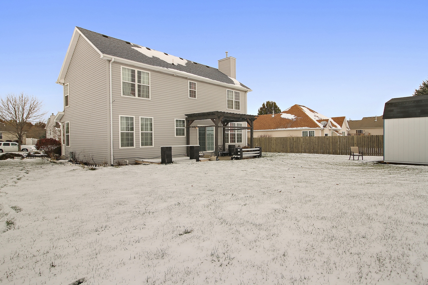 1906 Tallgrass Turn Kankakee, IL 60901 - Photo 22 of 23 a view of a house with a snow in the background