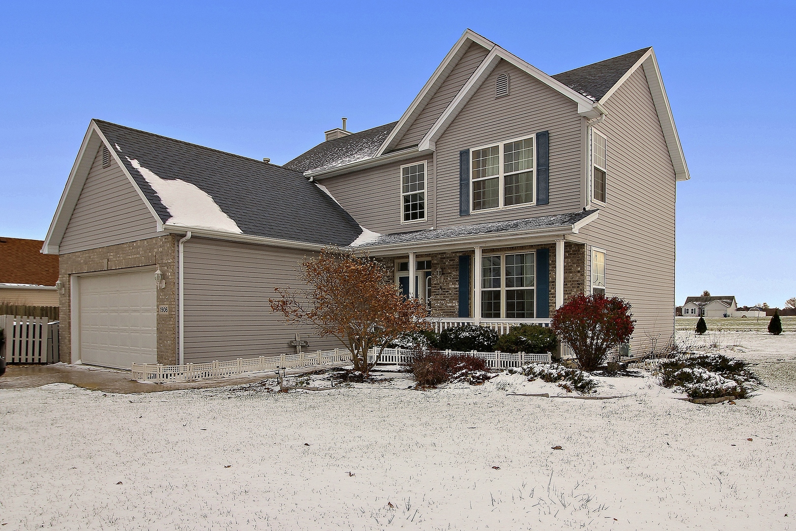 1906 Tallgrass Turn Kankakee, IL 60901 - Photo 23 of 23 a front view of a house with a yard and seating space