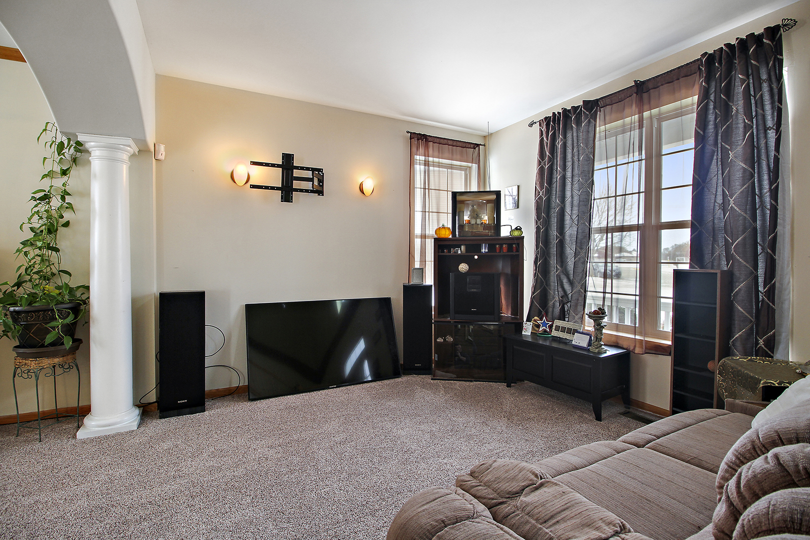 1906 Tallgrass Turn Kankakee, IL 60901 - Photo 4 of 23 a living room with furniture and a flat screen tv