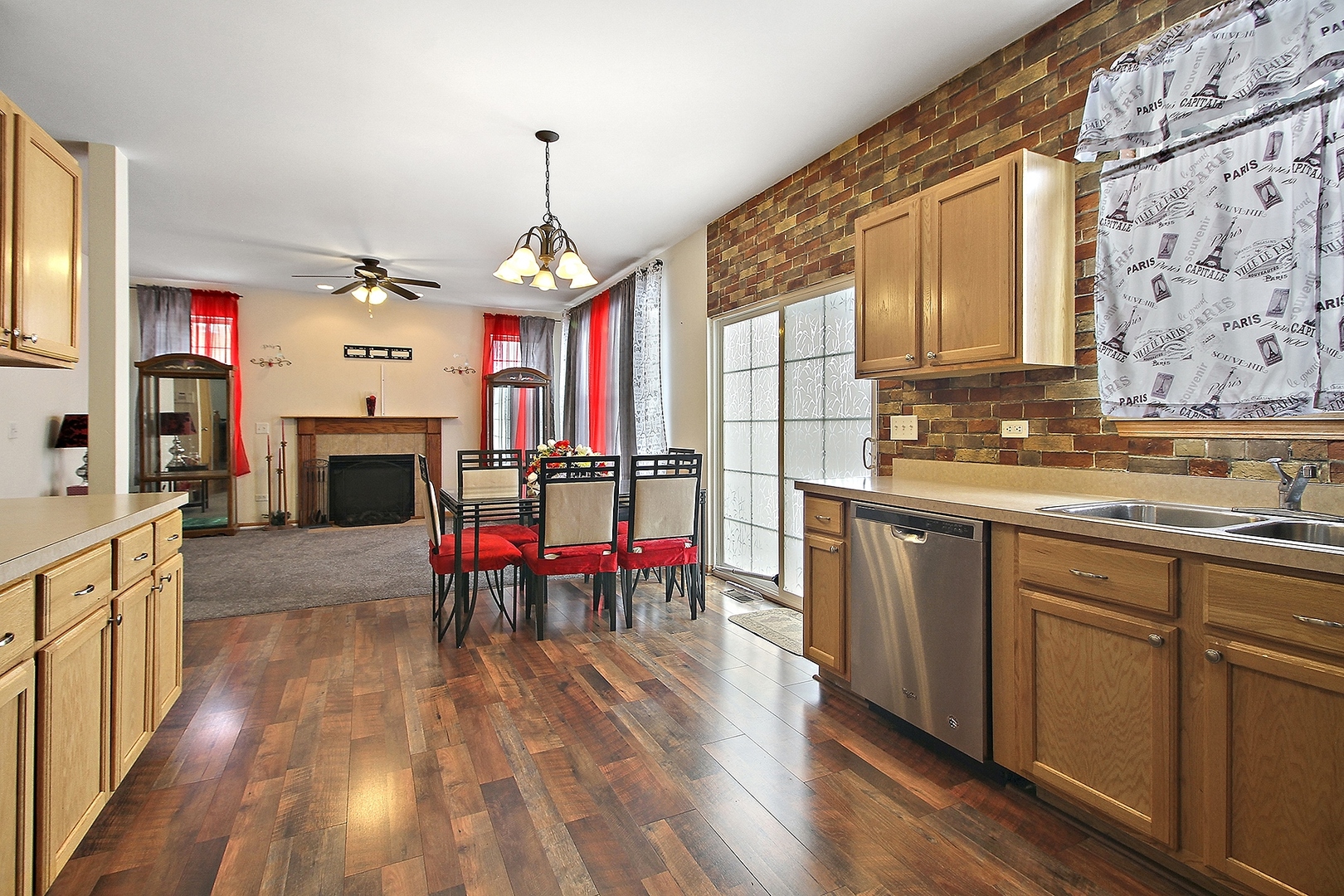1906 Tallgrass Turn Kankakee, IL 60901 - Photo 6 of 23 a open kitchen with stainless steel appliances granite countertop a kitchen island hardwood floor sink stove dining table and chairs