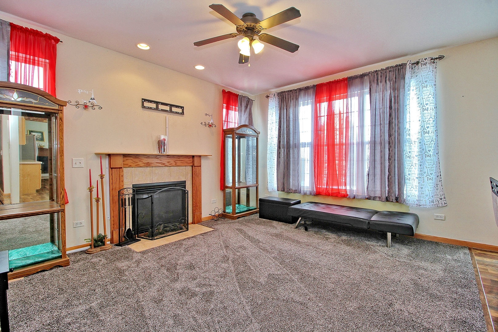 1906 Tallgrass Turn Kankakee, IL 60901 - Photo 10 of 23 a view of an empty room with a fireplace and a window