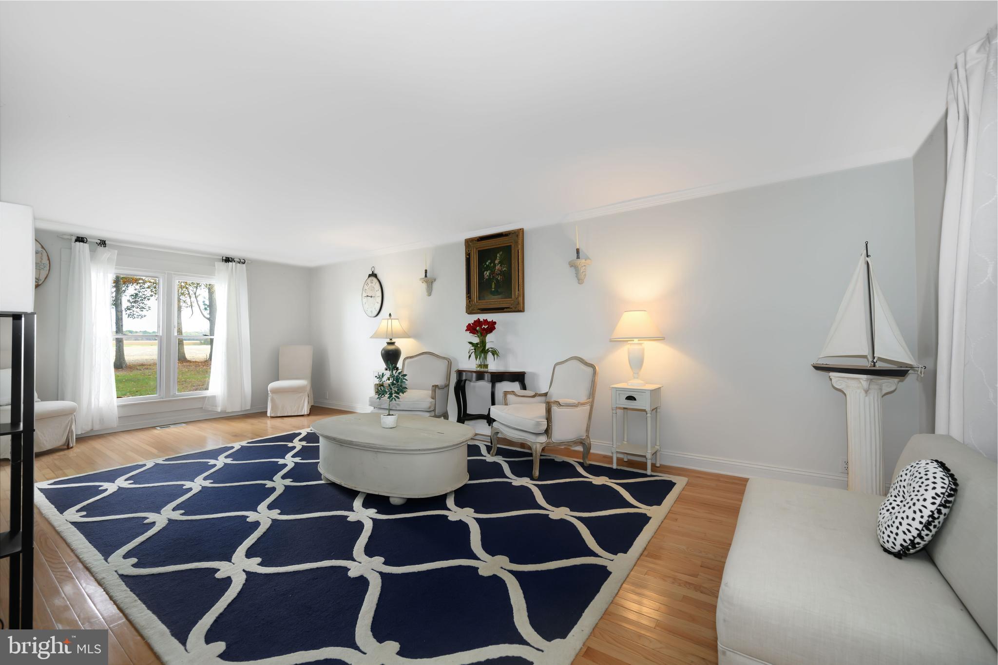 2669 Ocean Gateway Trappe, MD 21673 - Photo 15 of 47 a living room with furniture a flat screen tv and a window