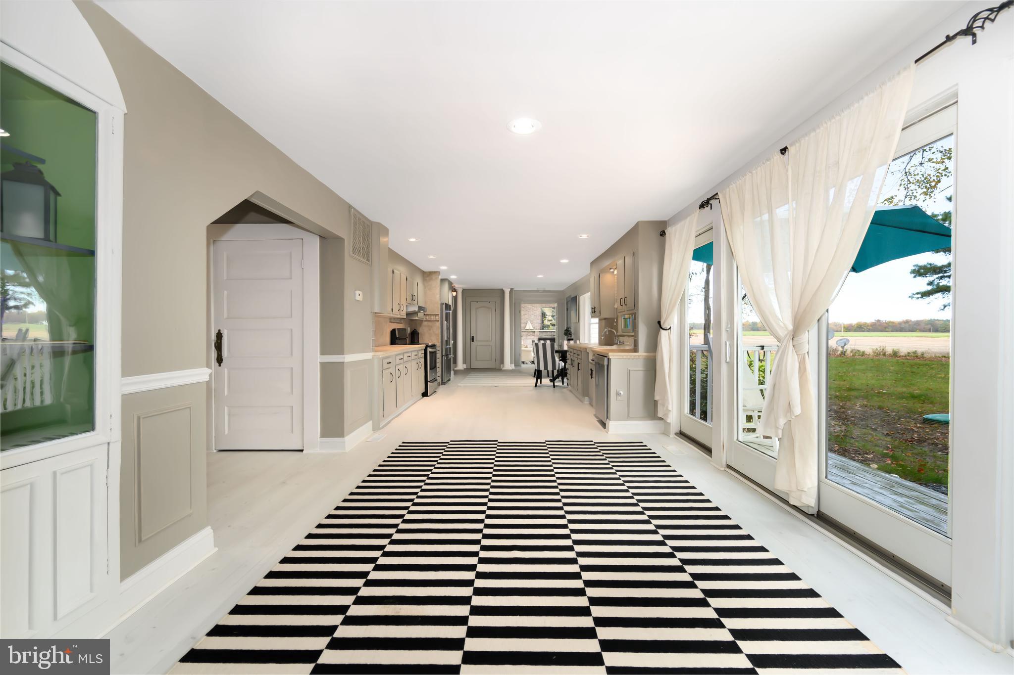 2669 Ocean Gateway Trappe, MD 21673 - Photo 17 of 47 a view of a hallway with wooden floor and windows