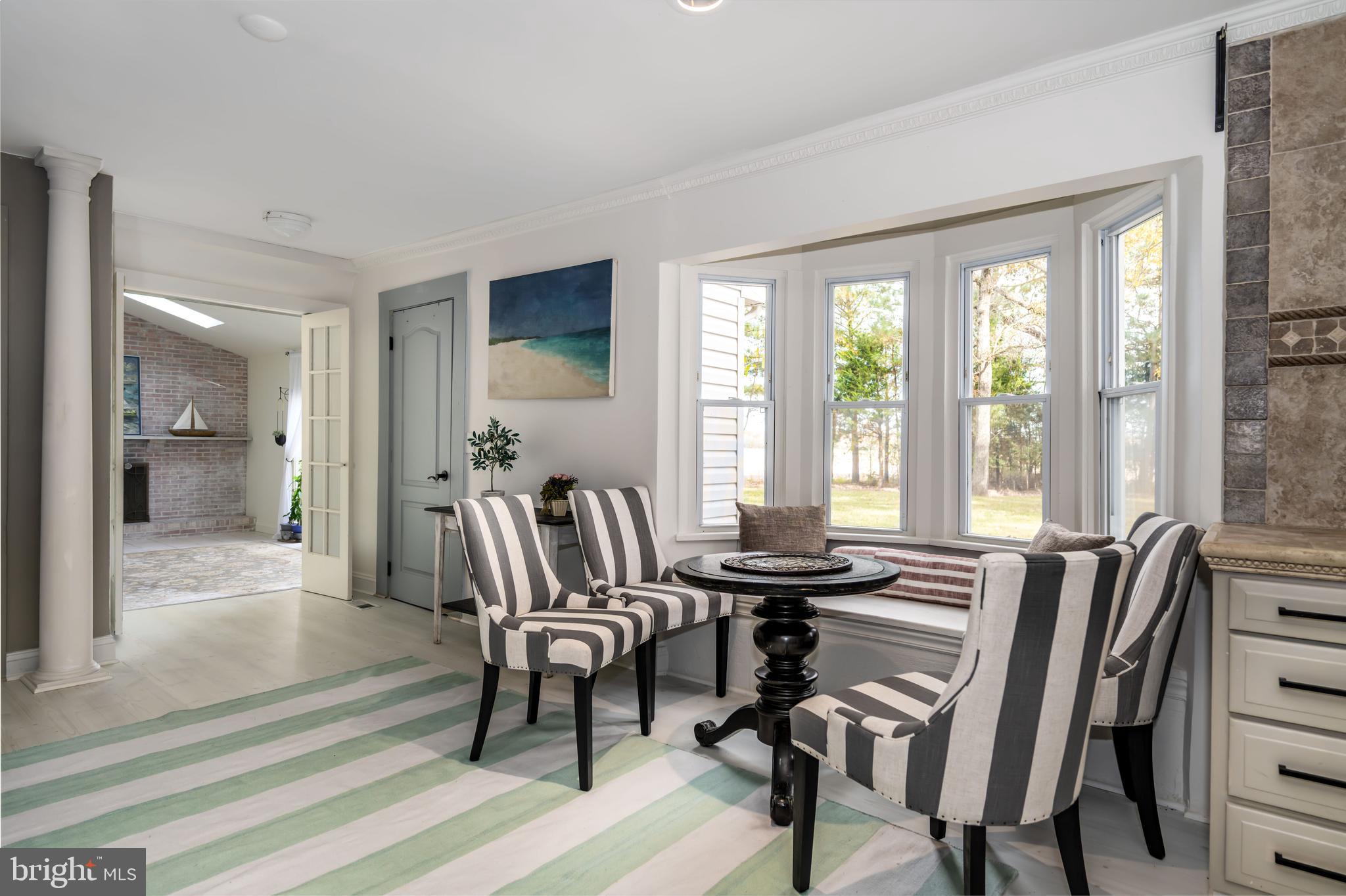 2669 Ocean Gateway Trappe, MD 21673 - Photo 18 of 47 a view of a a dining room with furniture window and outside view