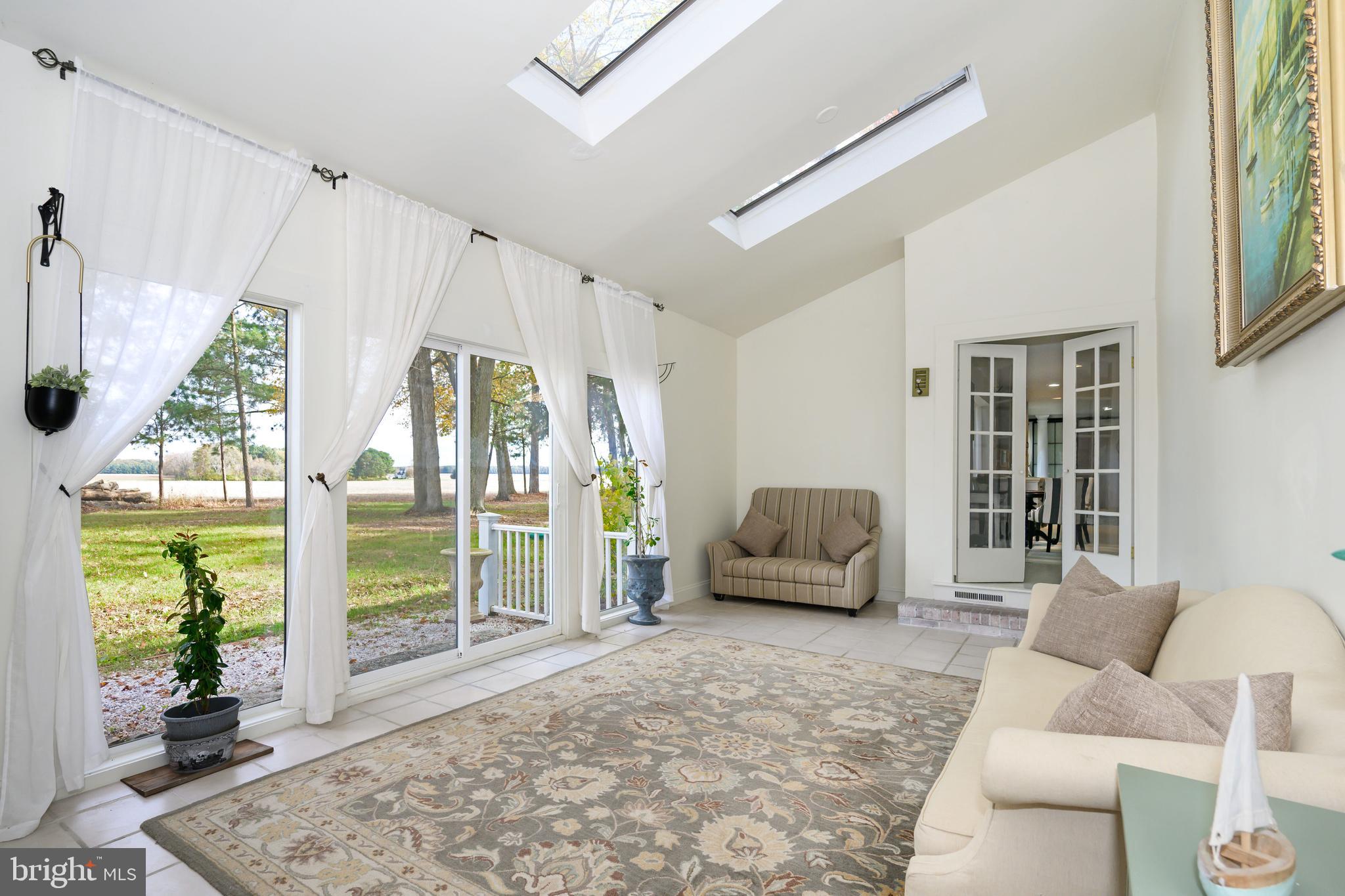 2669 Ocean Gateway Trappe, MD 21673 - Photo 21 of 47 a living room with furniture and a large window