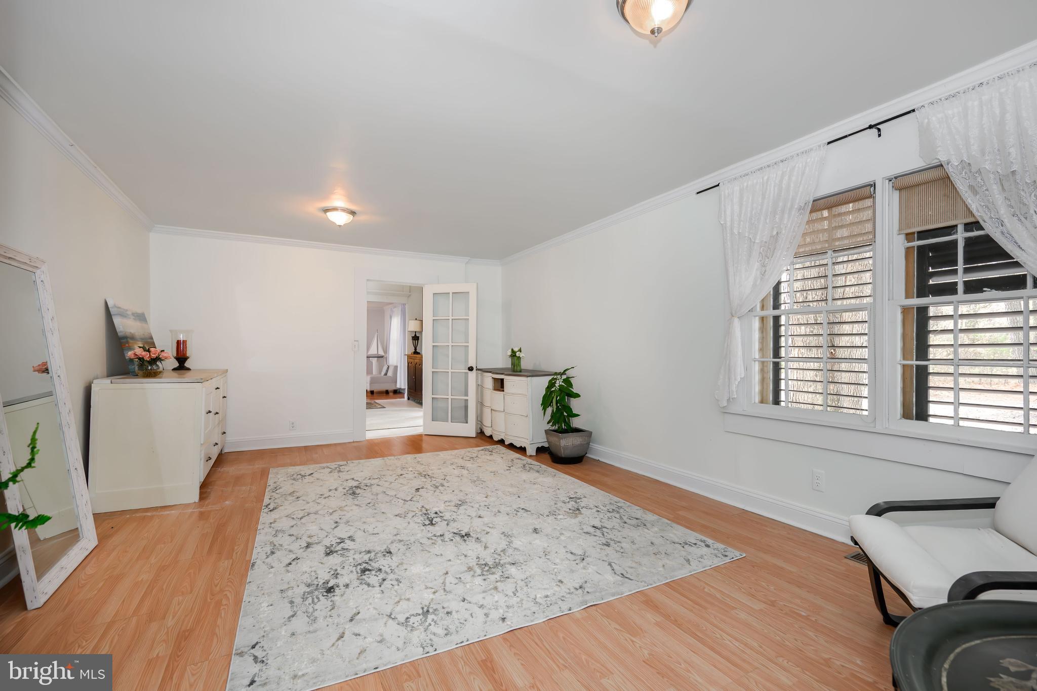 2669 Ocean Gateway Trappe, MD 21673 - Photo 22 of 47 a view of a bedroom with wooden floor and a window