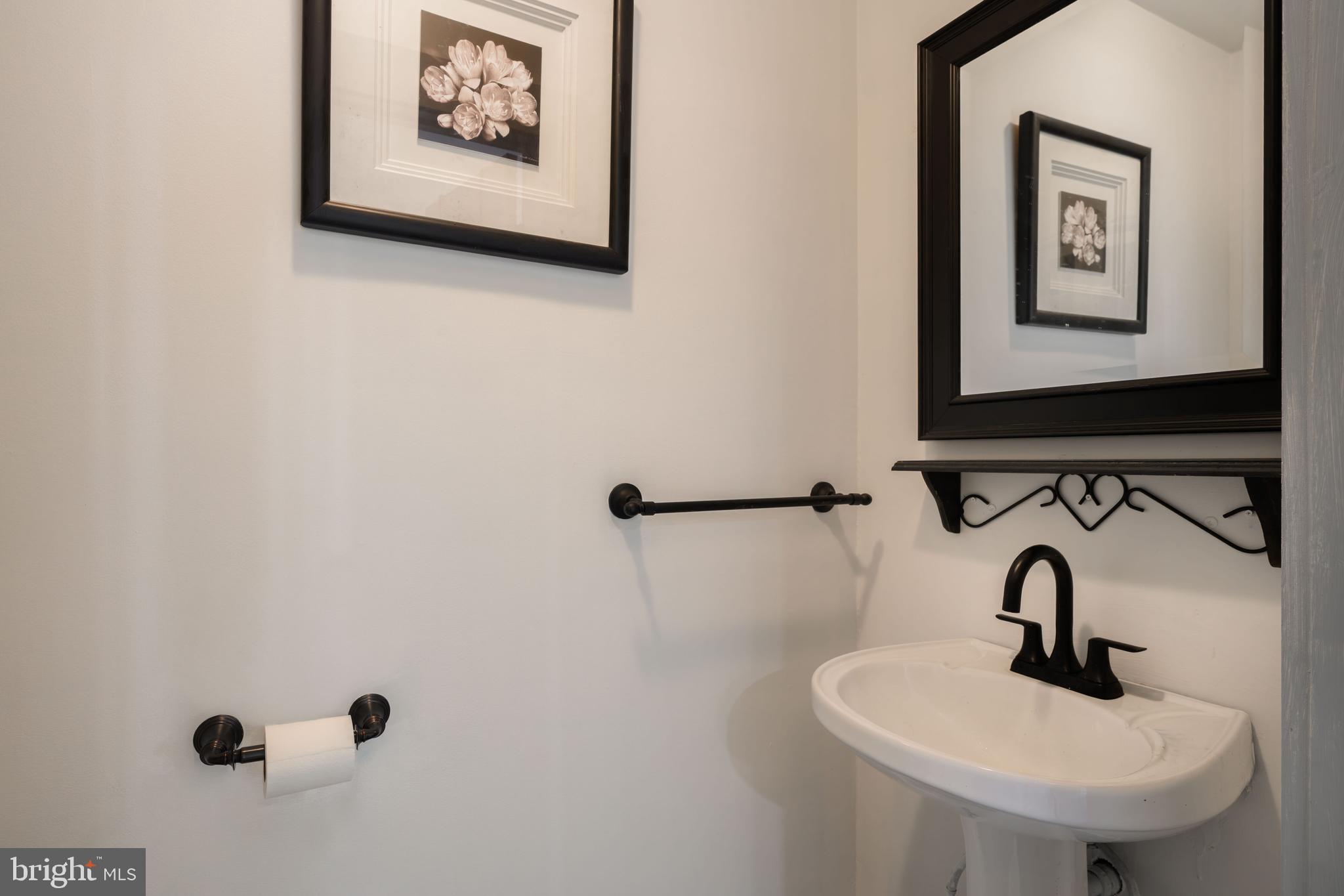 2669 Ocean Gateway Trappe, MD 21673 - Photo 24 of 47 a bathroom with a sink and a mirror