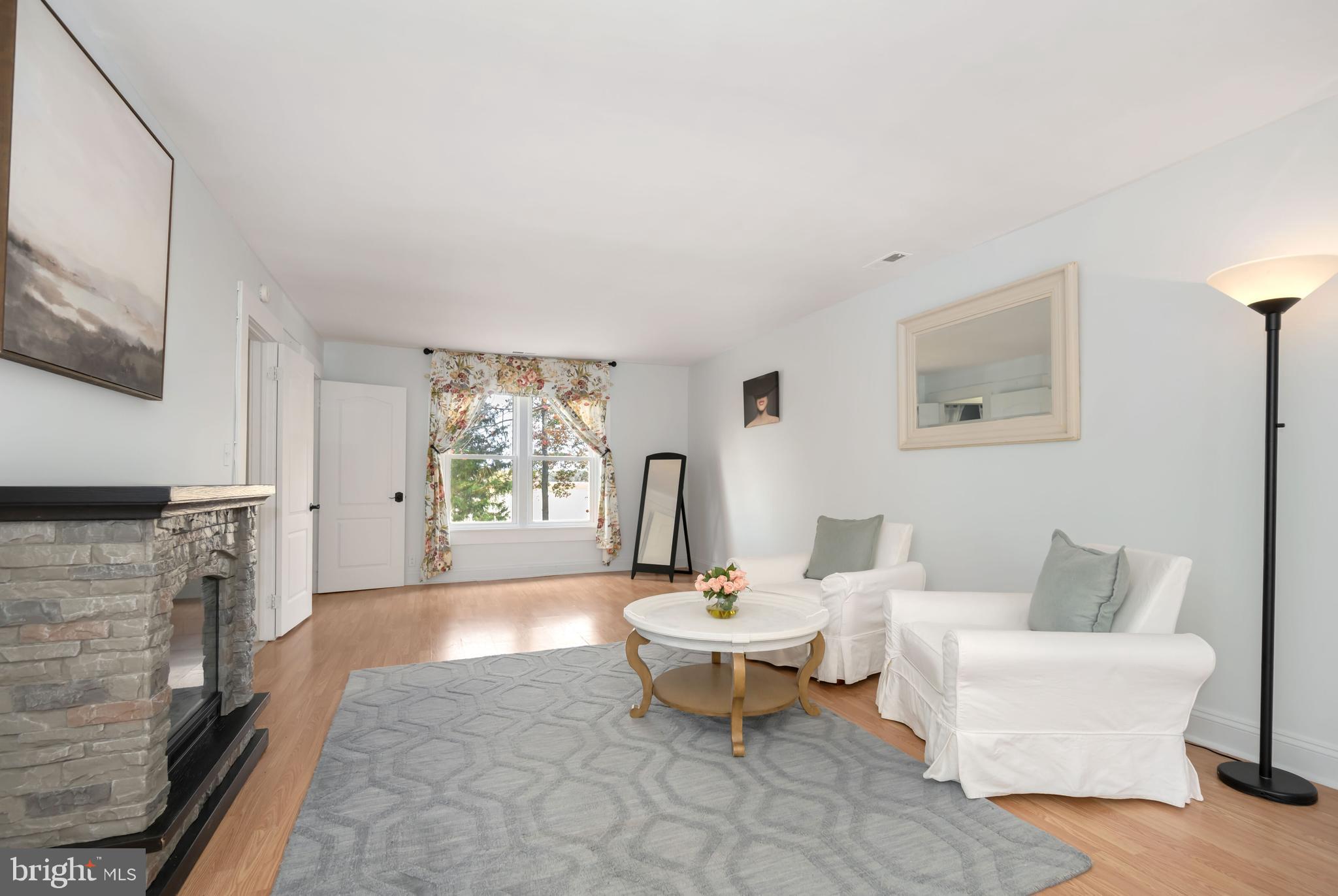 2669 Ocean Gateway Trappe, MD 21673 - Photo 29 of 47 a living room with furniture a window and a fireplace
