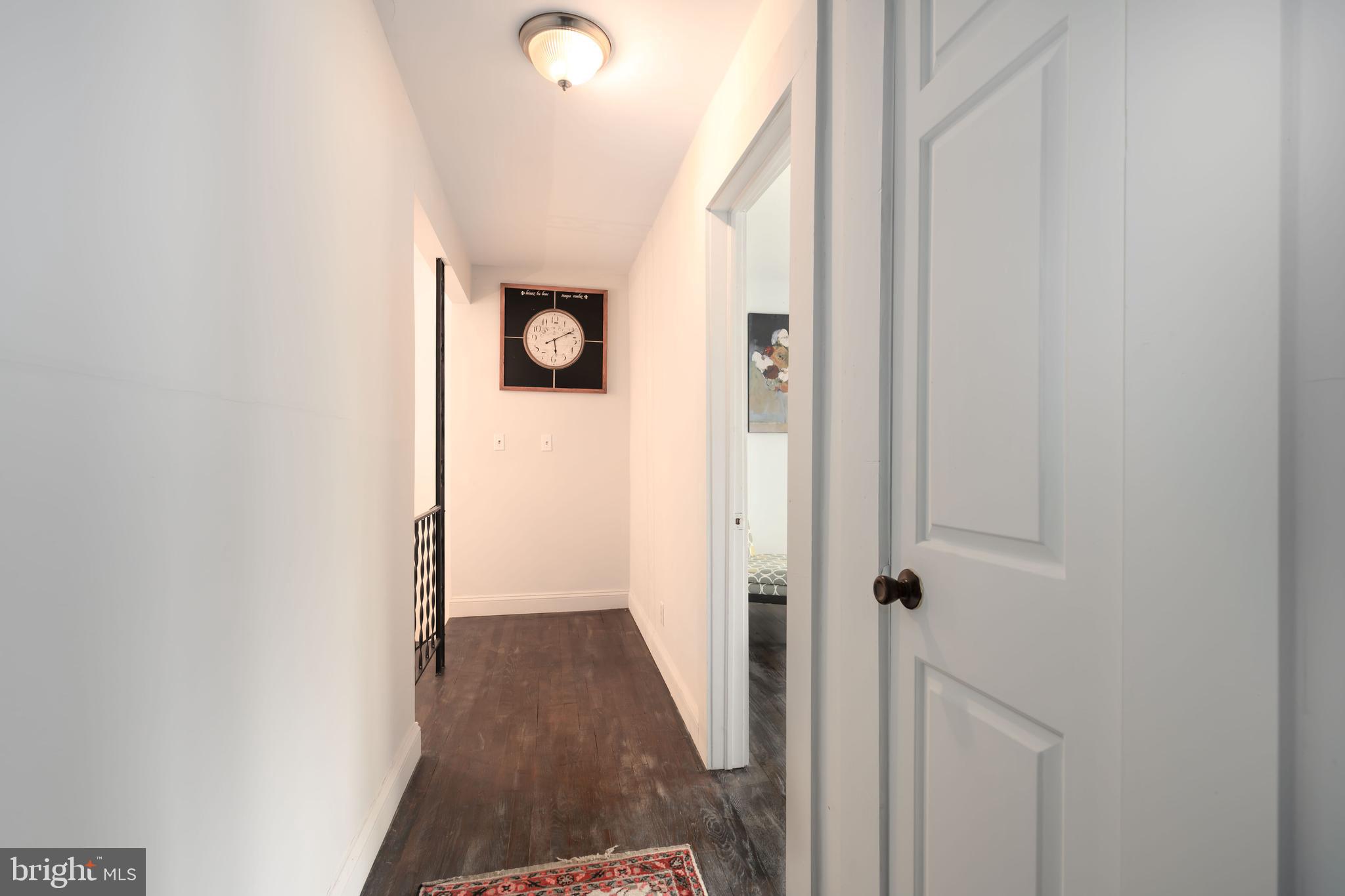 2669 Ocean Gateway Trappe, MD 21673 - Photo 34 of 47 a view of a hallway with wooden floor